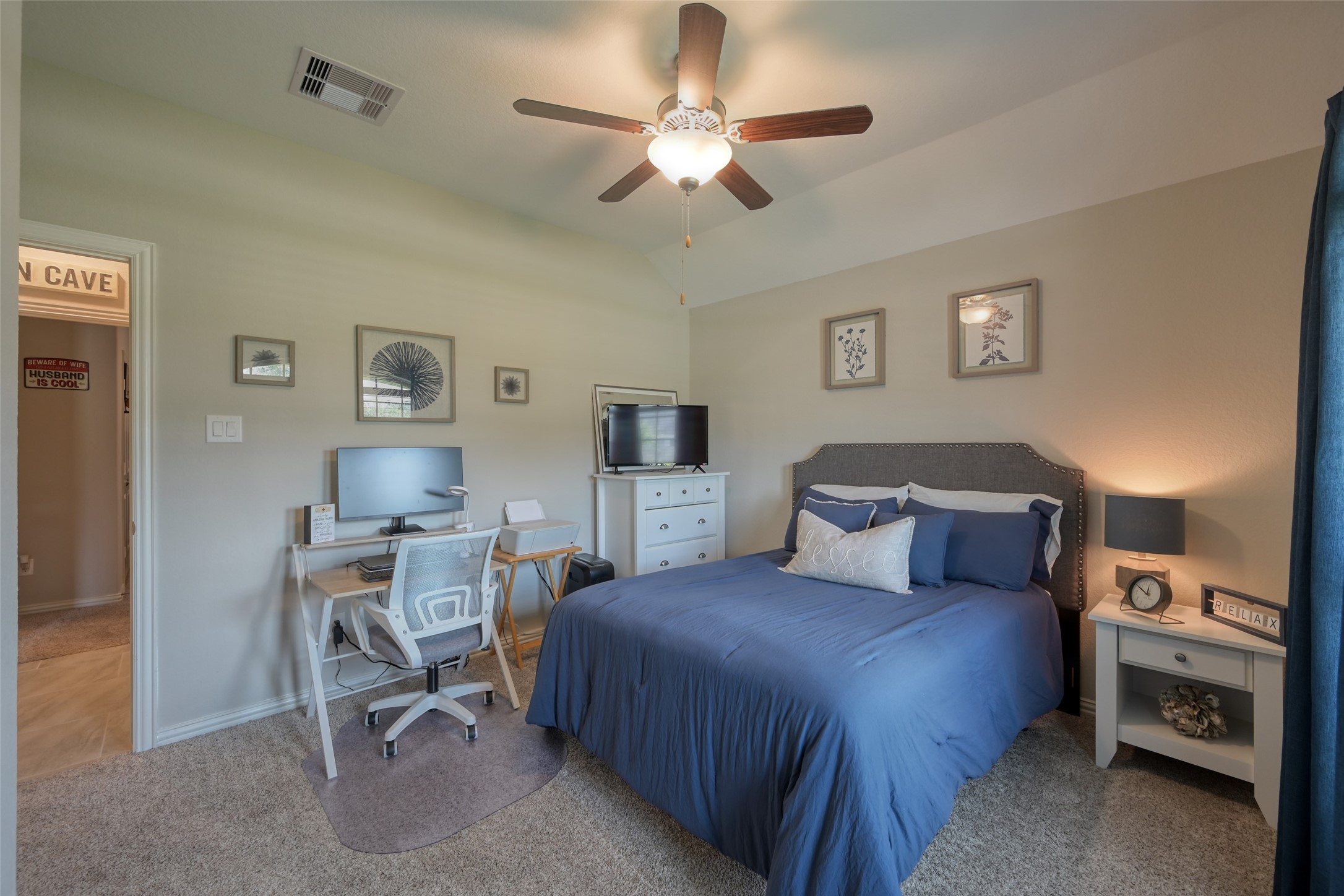 3465 Stablewood Grove Lane Spring, TX 77386 - Photo 24 of 50 a bedroom with a bed and a chandelier
