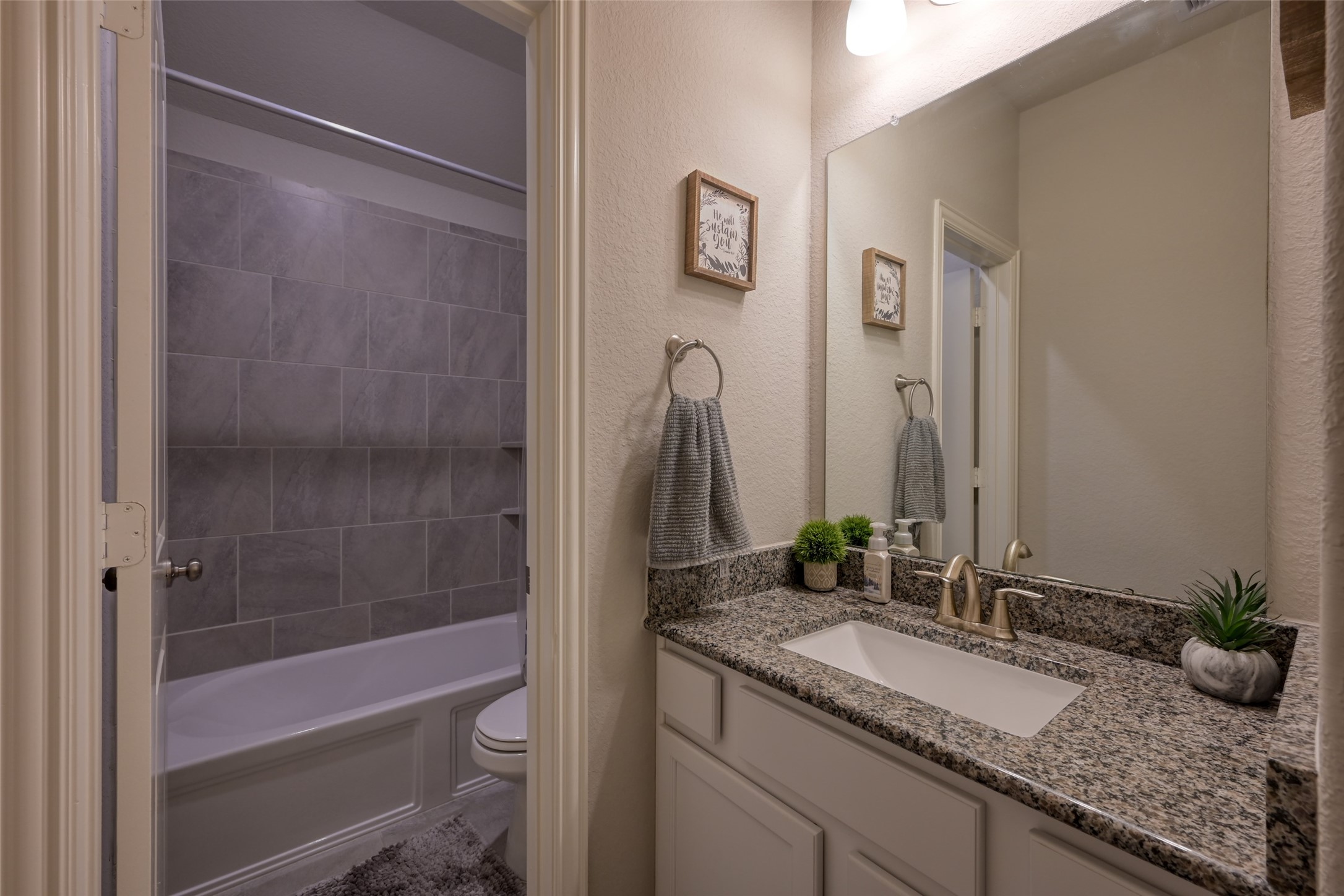 3465 Stablewood Grove Lane Spring, TX 77386 - Photo 25 of 50 a bathroom with a granite countertop sink a toilet and shower