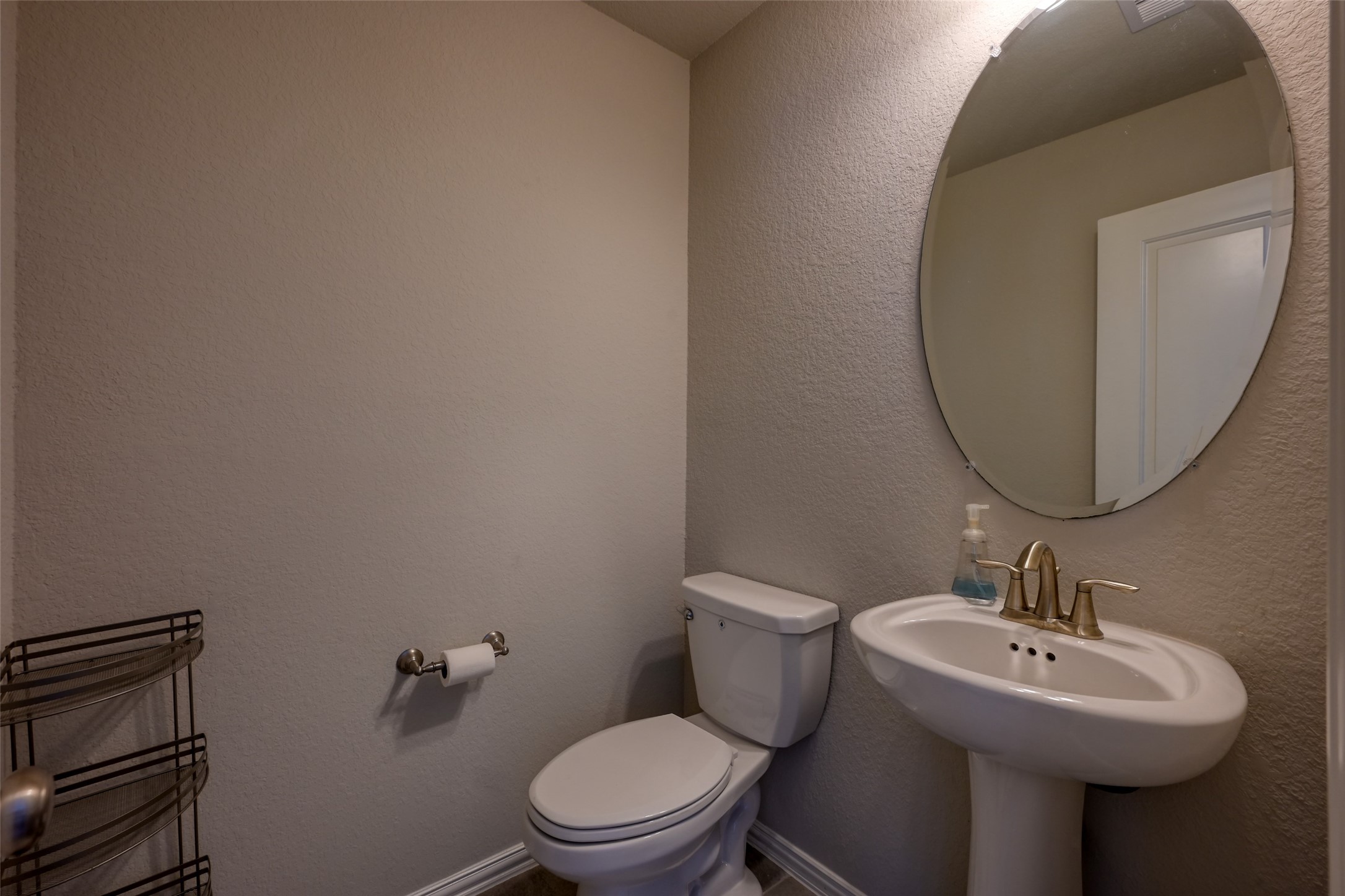 3465 Stablewood Grove Lane Spring, TX 77386 - Photo 31 of 50 a bathroom with a sink toilet and a mirror