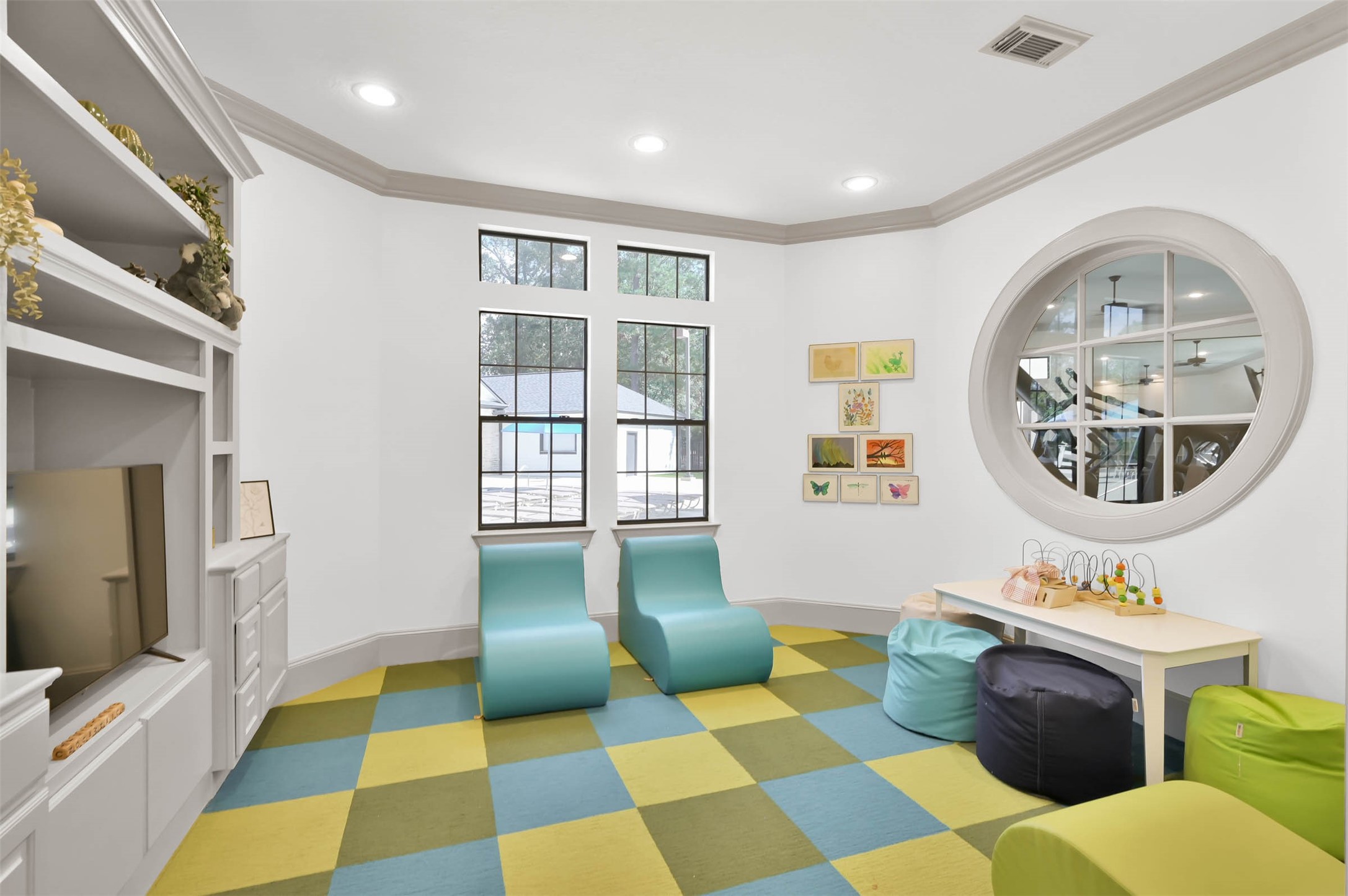 3465 Stablewood Grove Lane Spring, TX 77386 - Photo 44 of 50 a living room with a black white checkered floor with a gaming machine and dining chairs