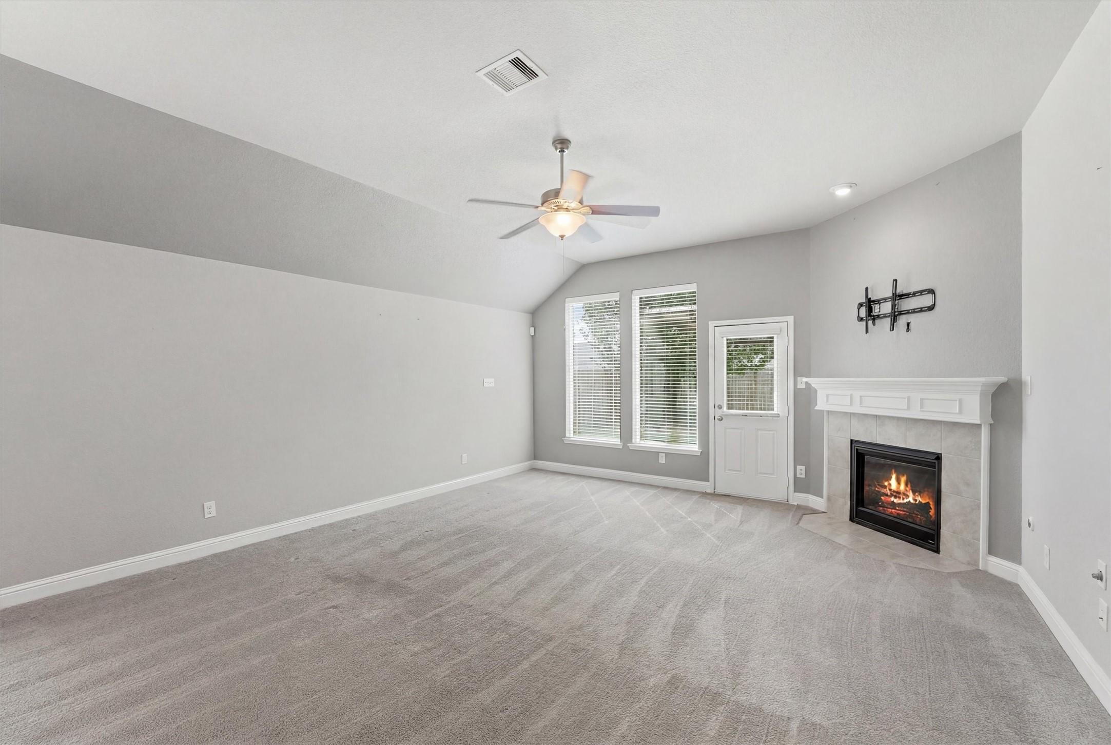 1911 Cedar Ridge Lane Pearland, TX 77089 - Photo 16 of 33 Spacious living room with gas log fireplace and high ceilings - *fireplace virtually lit*
