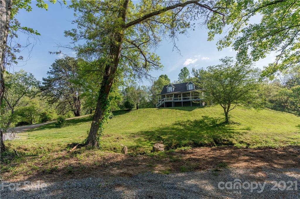301 Fowler Lane Clyde, NC 28721 - Photo 16 of 47 a view of a yard with a tree
