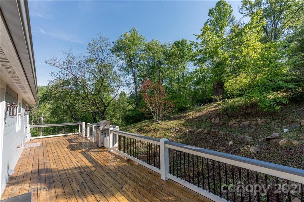 301 Fowler Lane Clyde, NC 28721 - Photo 25 of 47 a view of balcony with wooden floor and fence