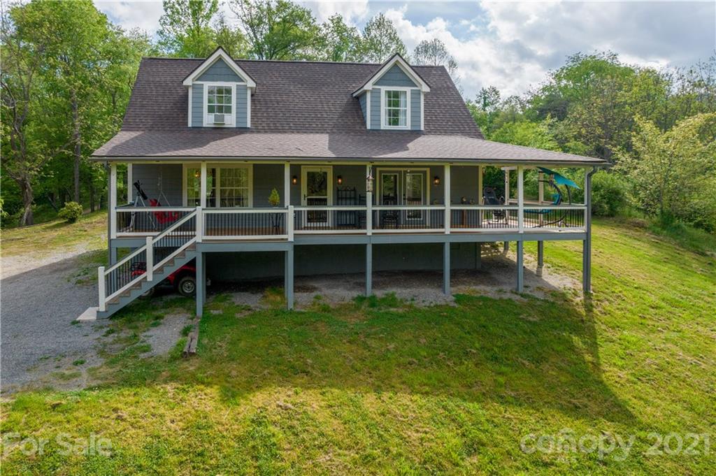 301 Fowler Lane Clyde, NC 28721 - Photo 26 of 47 a view of a house with a yard and sitting area