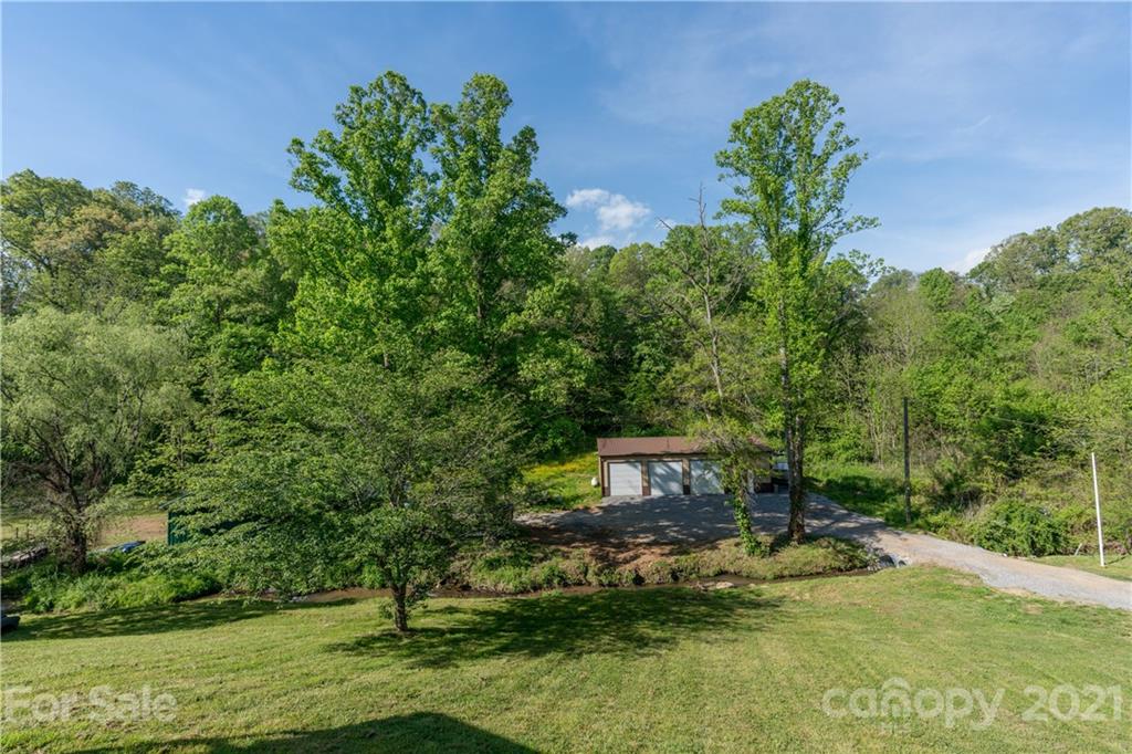 301 Fowler Lane Clyde, NC 28721 - Photo 30 of 47 a small pool with trees in the background