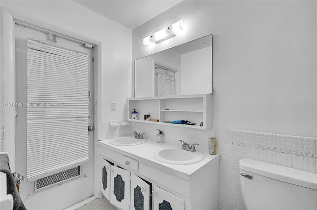 a bedroom with a bed and a night stand