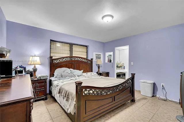 a bedroom with a bed and furniture