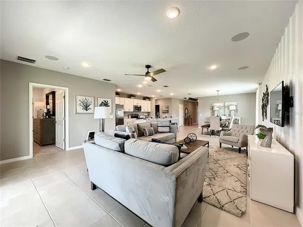 a kitchen with sink a stove and cabinets