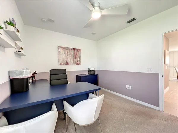 a view of a workspace with furniture