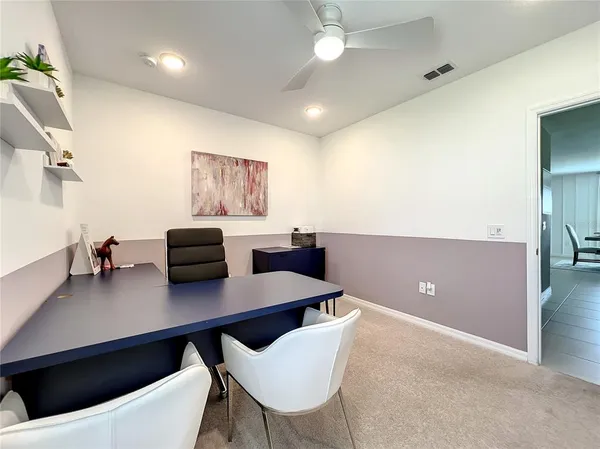 a view of a workspace with furniture