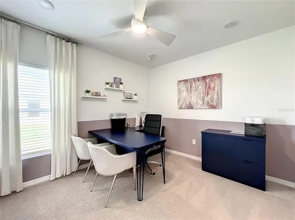 a workspace with furniture and wooden floor