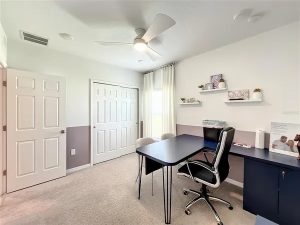 a workspace with furniture and window