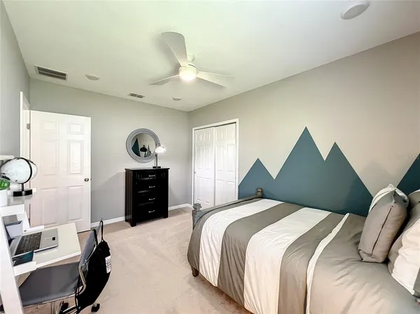 a bedroom with bed and window