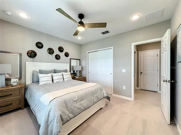 a bedroom with a large bed and a window