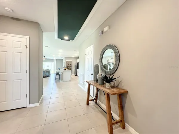 a living room with stainless steel appliances kitchen island granite countertop lots of counter top space