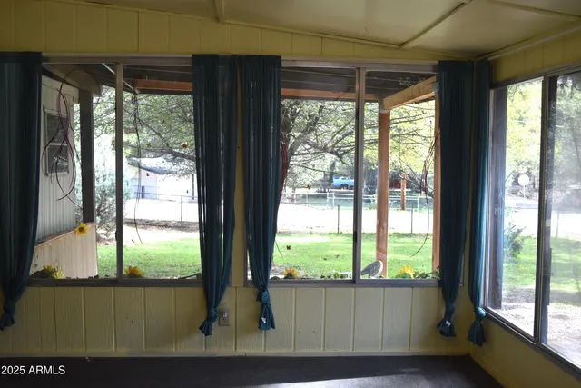 a view of a room that has a large window