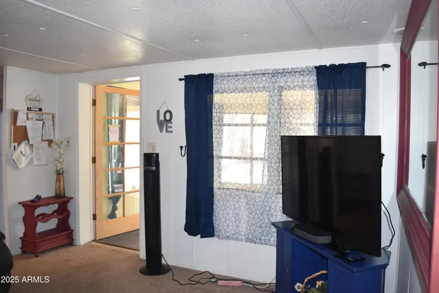 a view of a livingroom with furniture and windows