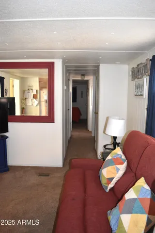 a hallway with a couch and a coffee table