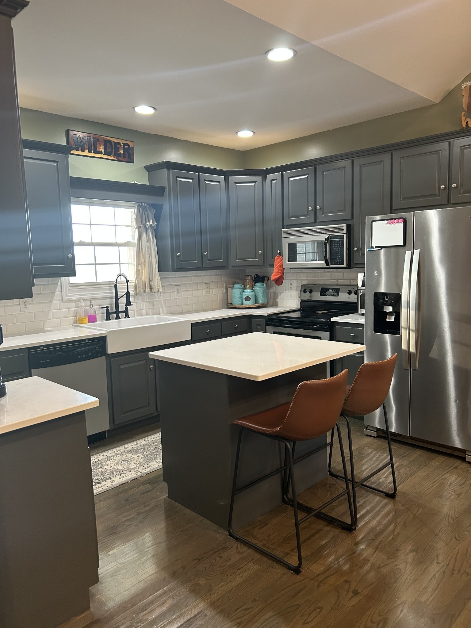 999 Featherstone Cemetary Road Decherd, TN 37324 - Photo 5 of 19 a kitchen with a sink a microwave a refrigerator and cabinets