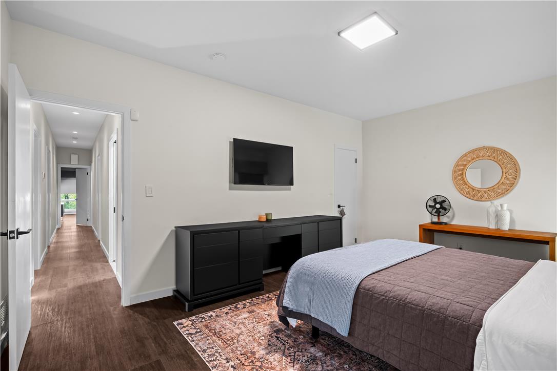 1506 Pleasant View Road Coopersburg, PA 18036 - Photo 55 of 97 Clean lines and a wood-look floor define this inviting bedroom, offering a serene retreat.