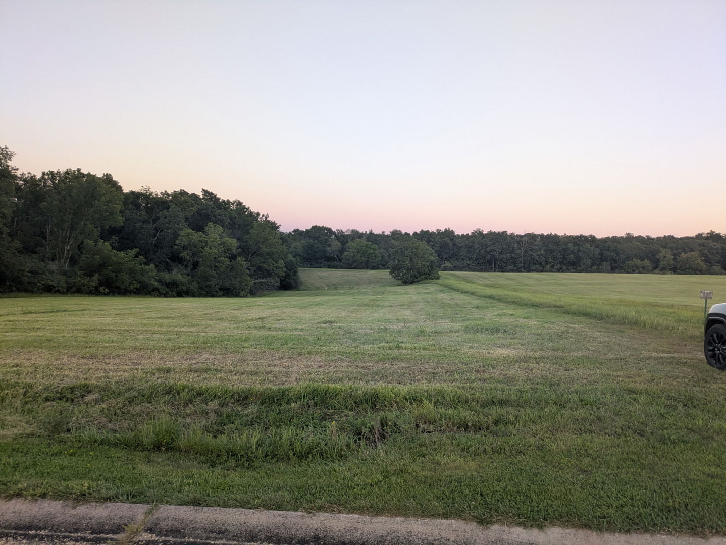 a view of a lake with a yard