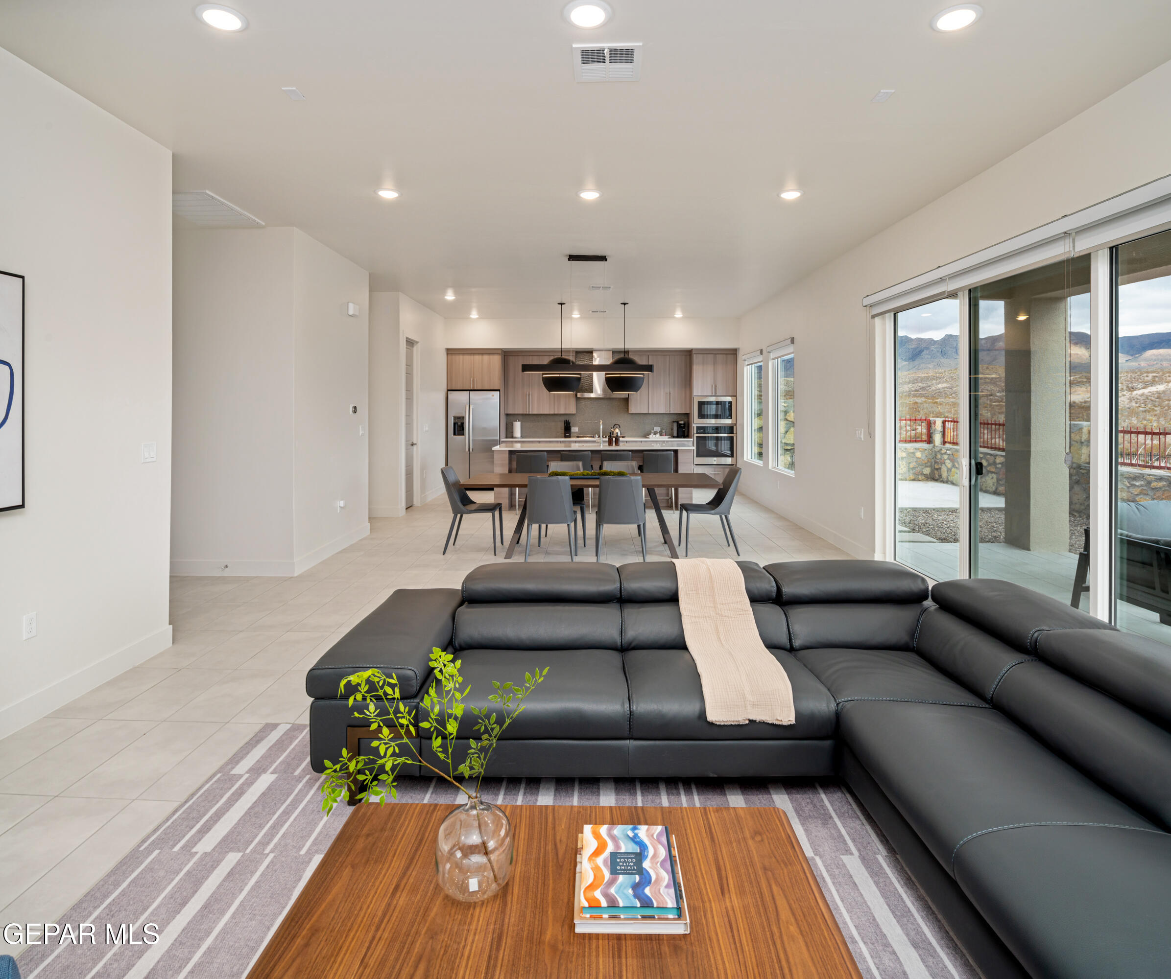 7280 Cimarron Rim Drive El Paso, TX 79911 - Photo 6 of 8 a living room with furniture and a large window