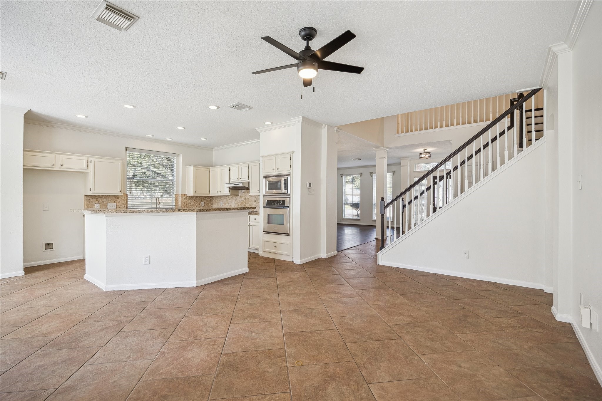 12831 Dove Point Lane Houston, TX 77041 - Photo 17 of 49 a view of kitchen with furniture and a ceiling fan
