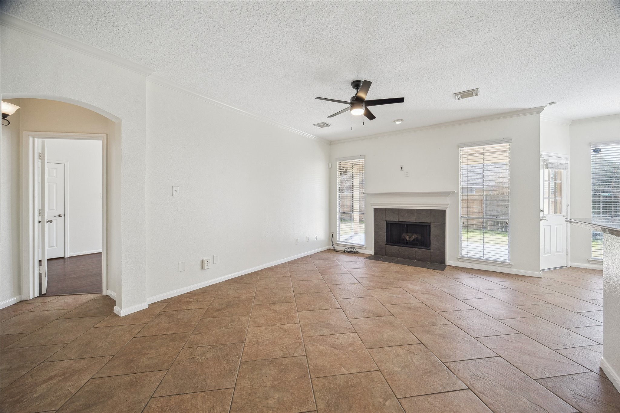 12831 Dove Point Lane Houston, TX 77041 - Photo 18 of 49 a view of an empty room with a fireplace