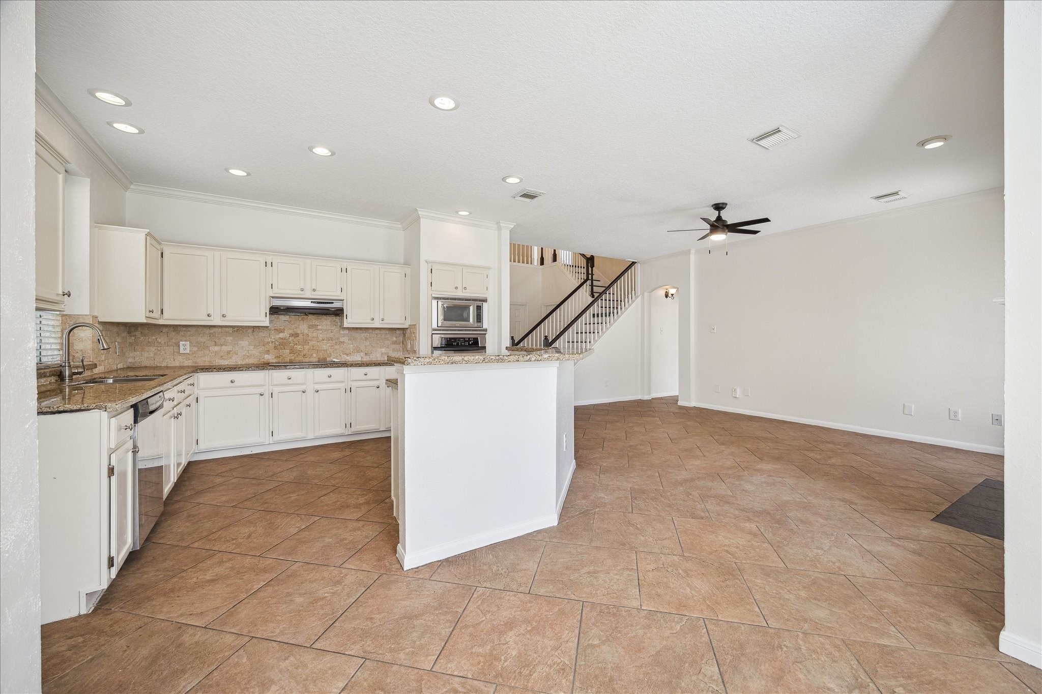 12831 Dove Point Lane Houston, TX 77041 - Photo 20 of 49 a kitchen with a sink cabinets and window