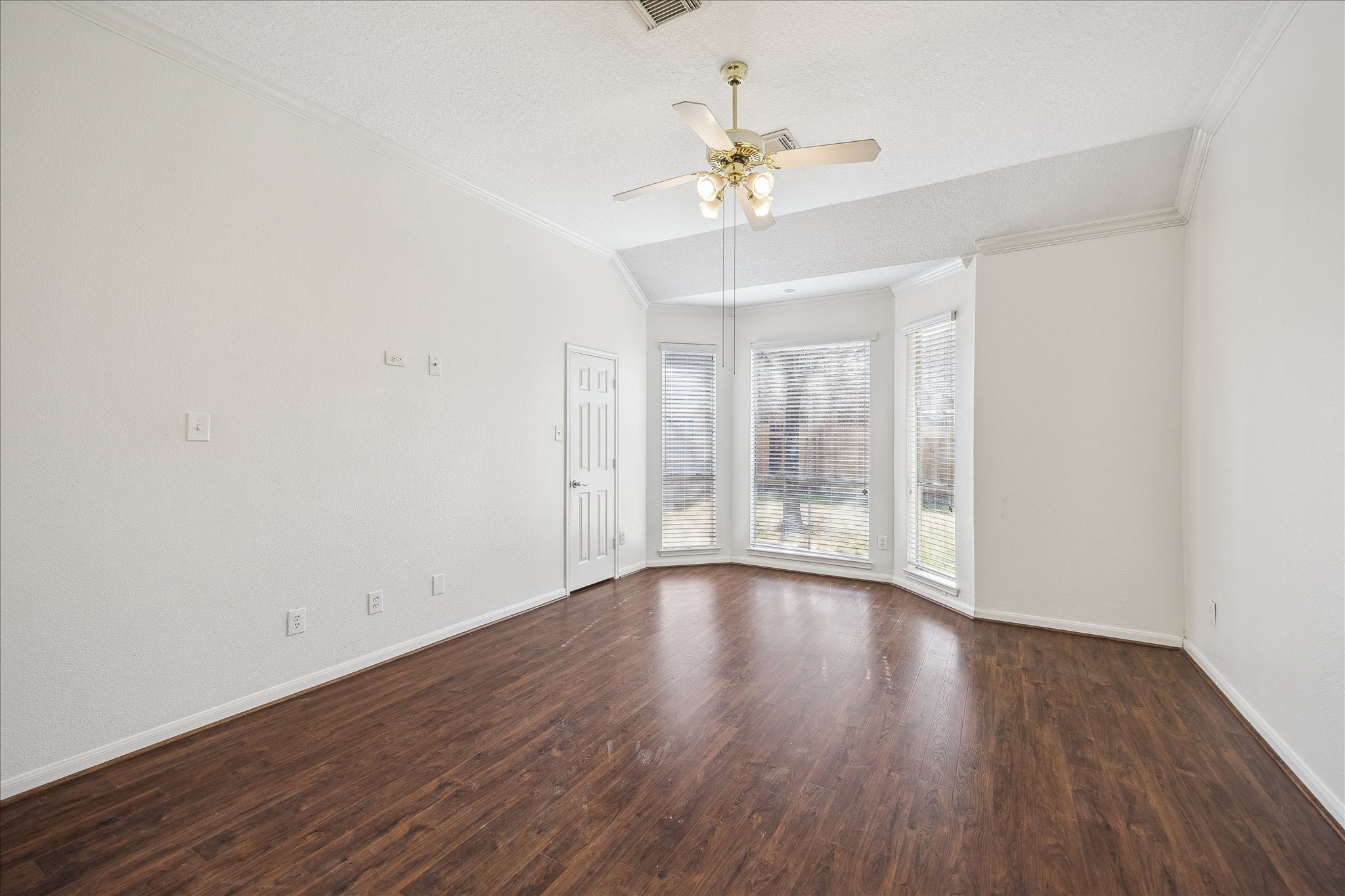12831 Dove Point Lane Houston, TX 77041 - Photo 32 of 49 a view of an empty room with wooden floor and a window