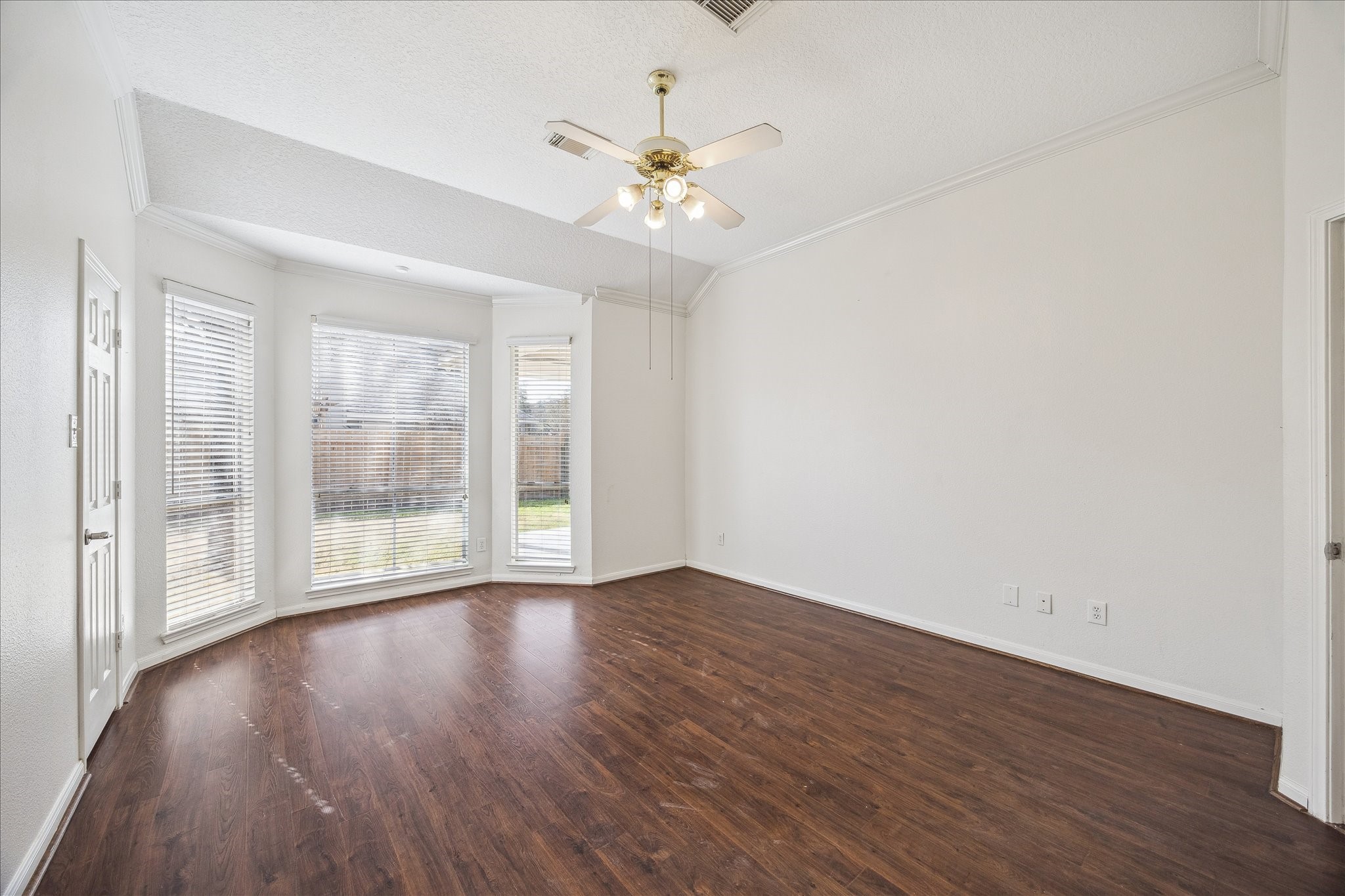 12831 Dove Point Lane Houston, TX 77041 - Photo 33 of 49 a view of an empty room with wooden floor and a window