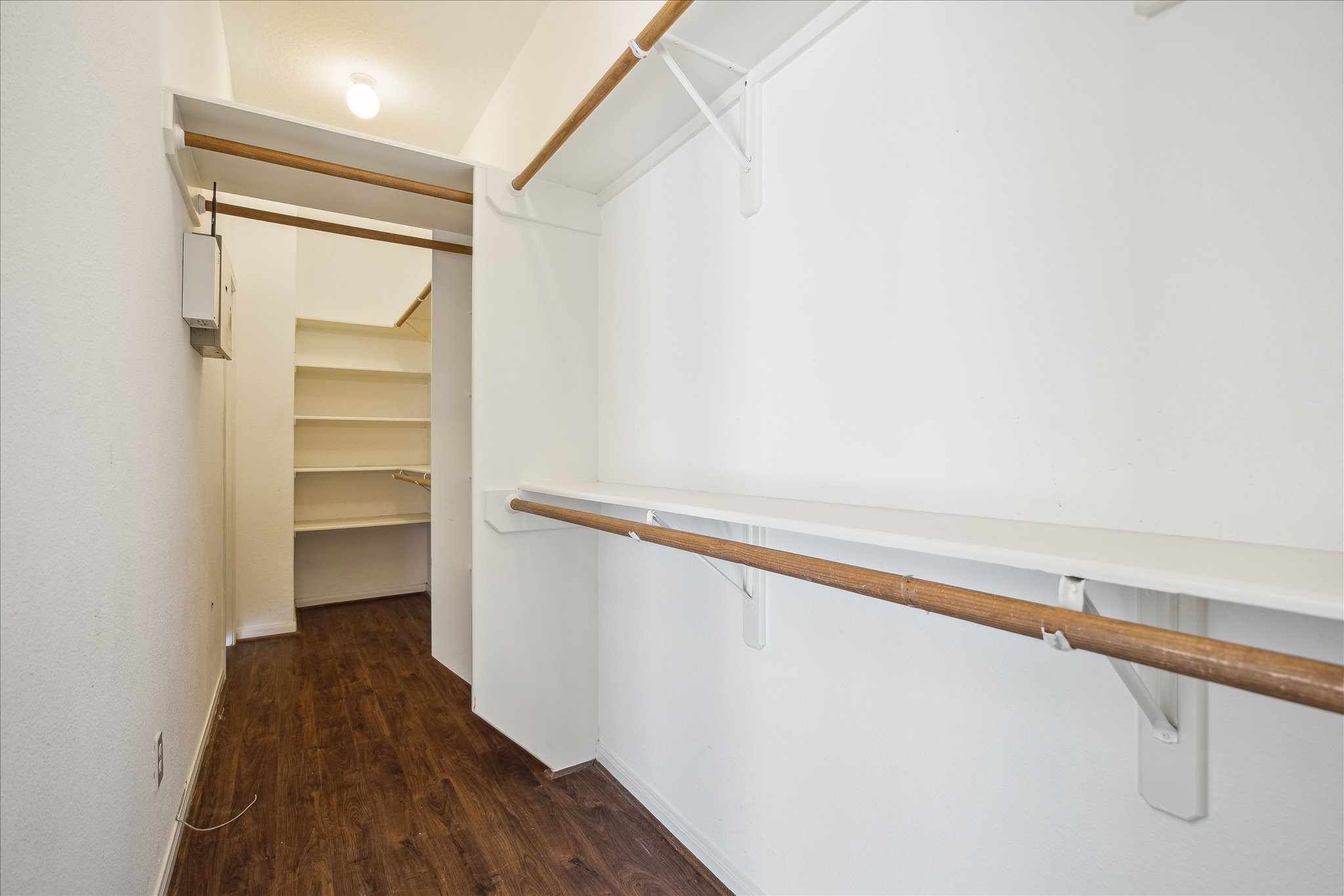 12831 Dove Point Lane Houston, TX 77041 - Photo 35 of 49 a view of walk in closet with empty racks