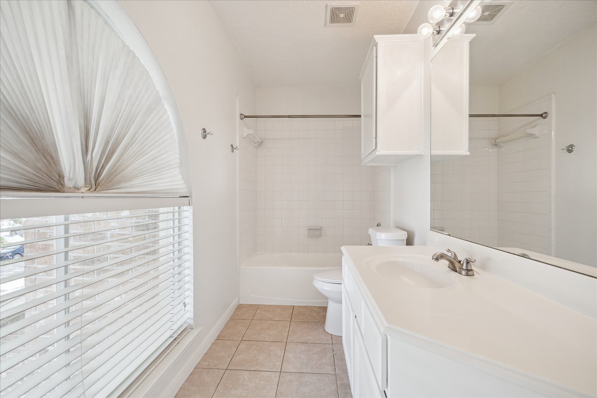12831 Dove Point Lane Houston, TX 77041 - Photo 48 of 49 a bathroom with a sink a bathtub and a shower
