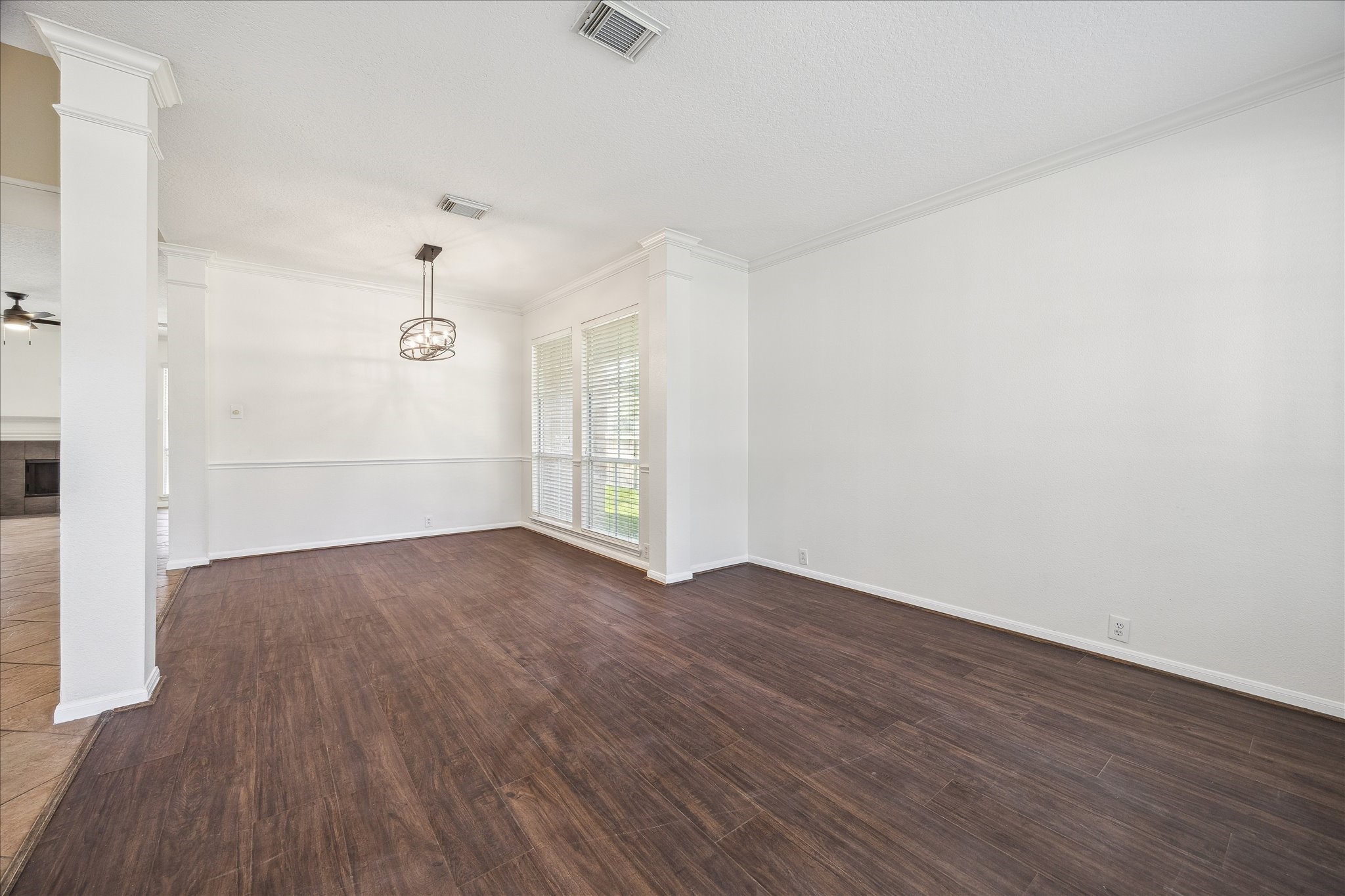 12831 Dove Point Lane Houston, TX 77041 - Photo 10 of 49 an empty room with wooden floor and windows