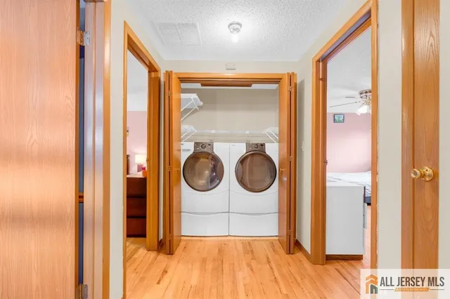 a view of a hallway with washer and dryer