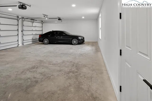 a spacious bathroom with a double vanity sink mirror and toilet