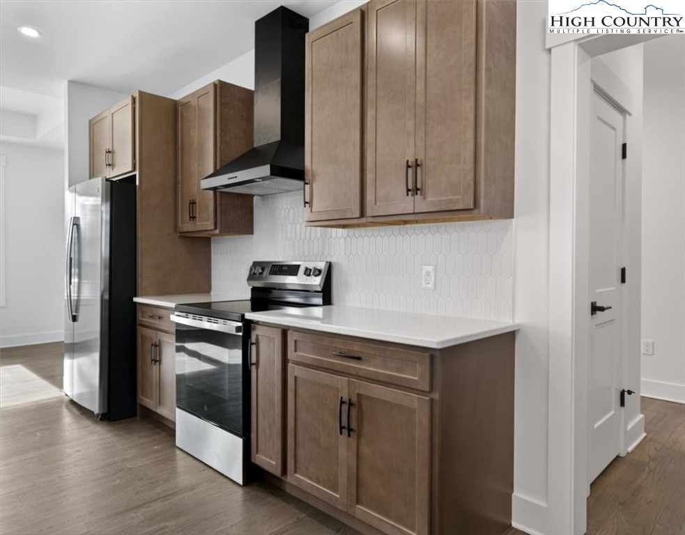 20 Busic Ridge Sparta, NC 28675 - Photo 23 of 50 a kitchen with stainless steel appliances granite countertop a stove a refrigerator and a sink