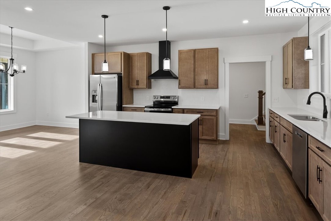 20 Busic Ridge Sparta, NC 28675 - Photo 28 of 50 a kitchen with stainless steel appliances granite countertop a sink a stove and a wooden floors