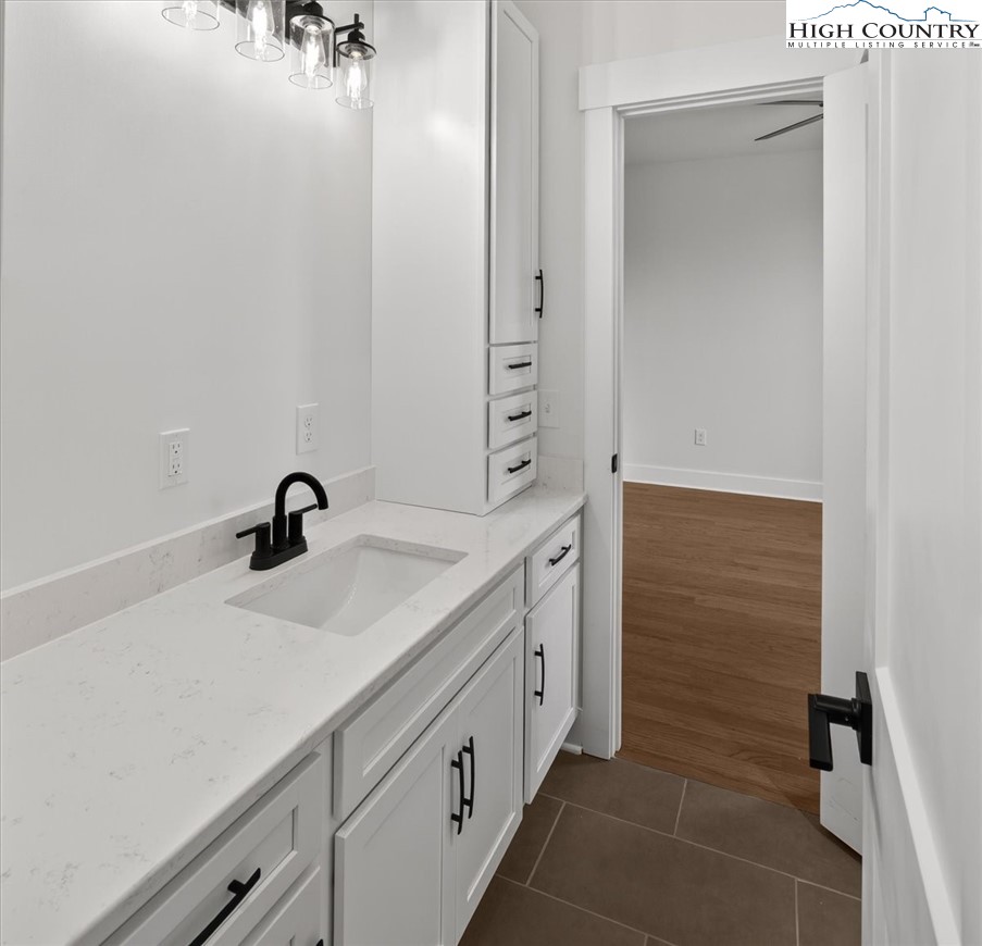 20 Busic Ridge Sparta, NC 28675 - Photo 32 of 50 a bathroom with a sink and a mirror