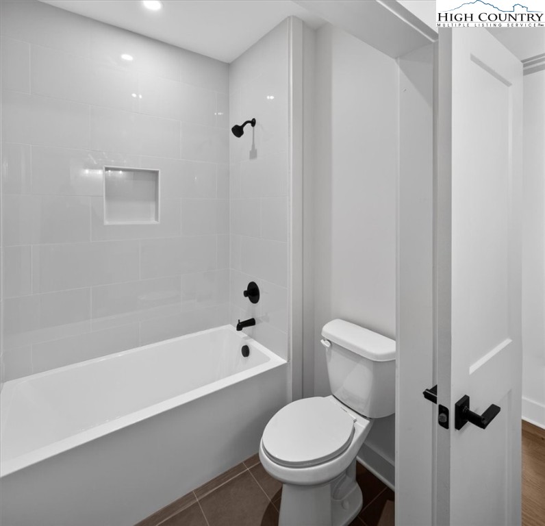 20 Busic Ridge Sparta, NC 28675 - Photo 33 of 50 a white toilet sitting next to a bath tub