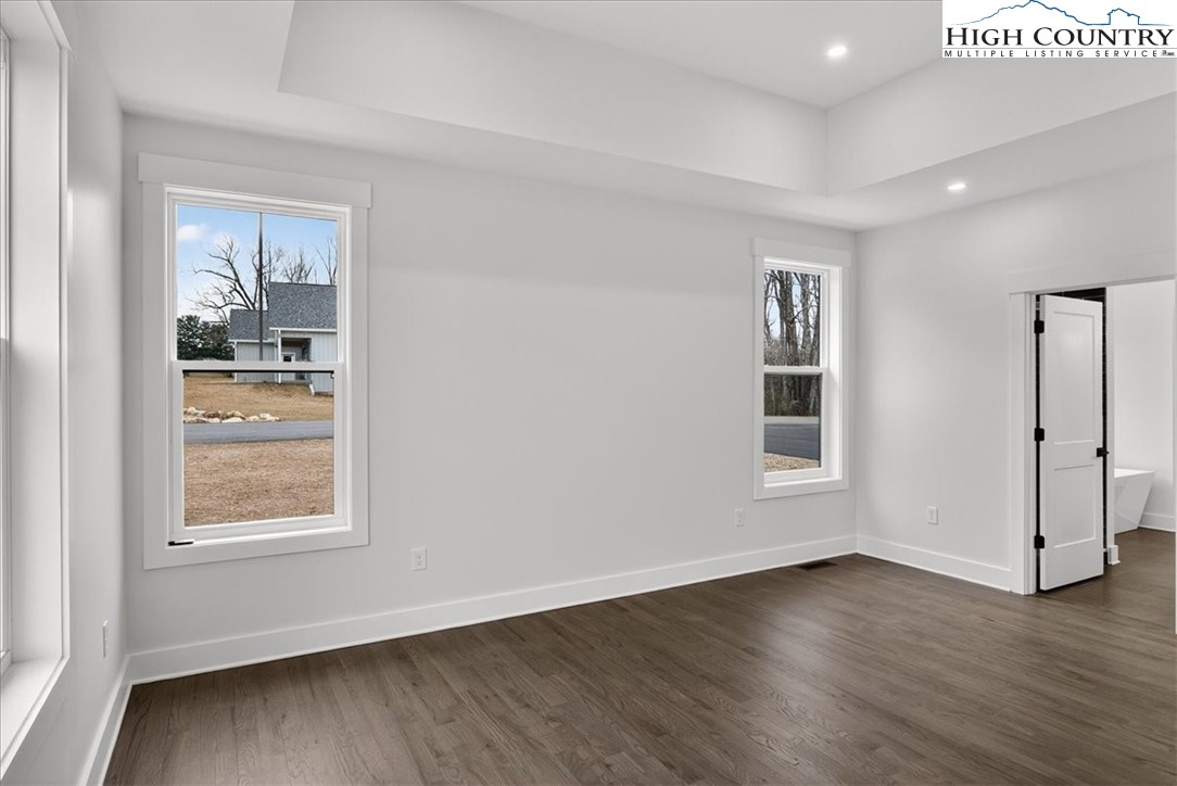 20 Busic Ridge Sparta, NC 28675 - Photo 36 of 50 an empty room with wooden floor and windows