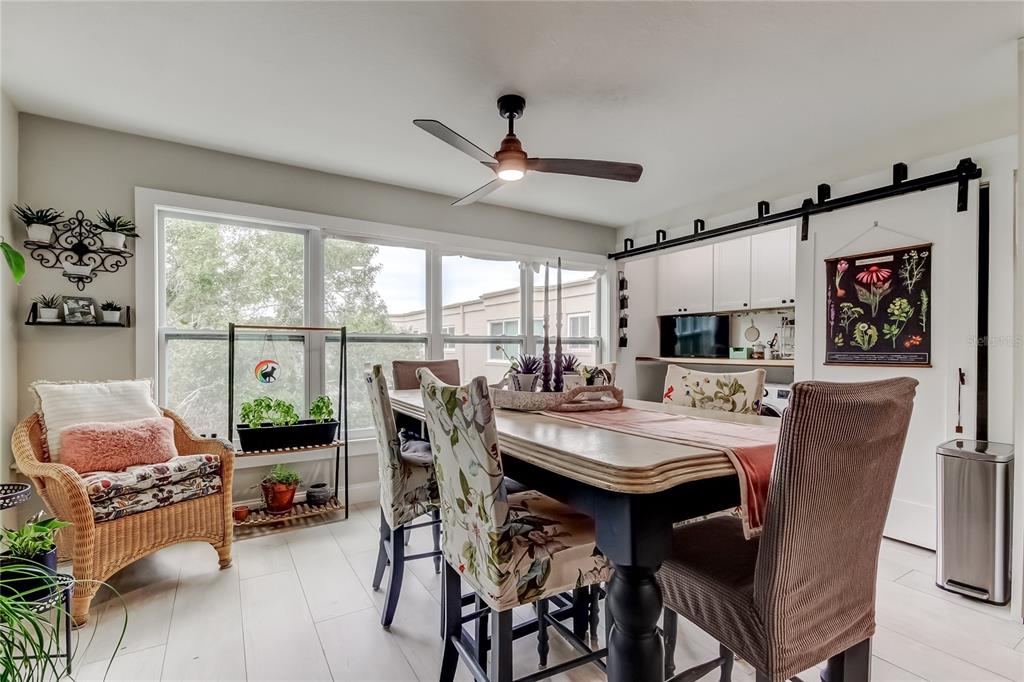 2170 Americus Boulevard North, Unit 64 Clearwater, FL 33763 - Photo 17 of 66 a view of a dining room with furniture window and outside view