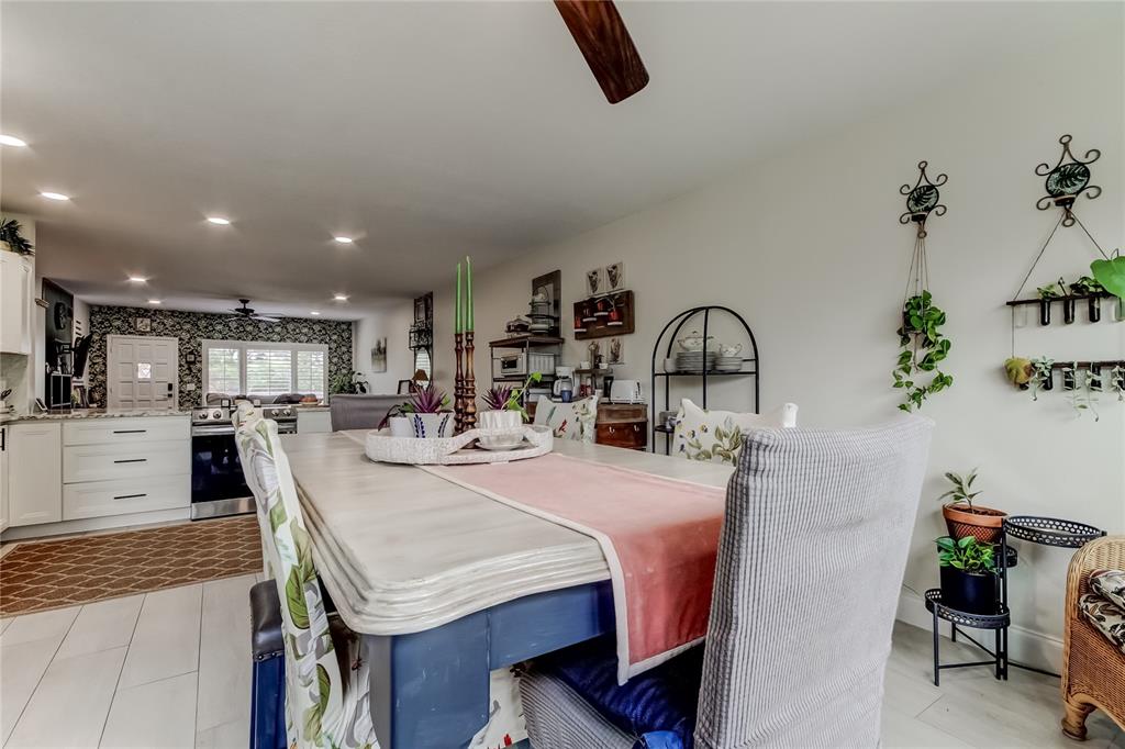2170 Americus Boulevard North, Unit 64 Clearwater, FL 33763 - Photo 19 of 66 a kitchen with stainless steel appliances granite countertop a sink a stove and a refrigerator