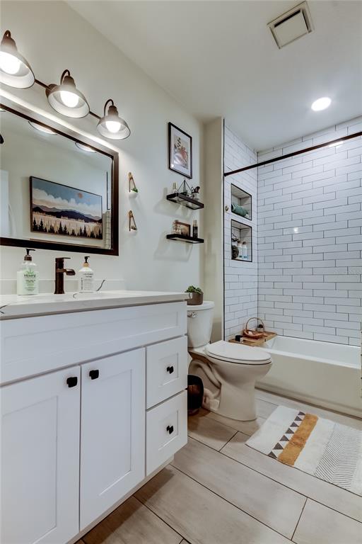 2170 Americus Boulevard North, Unit 64 Clearwater, FL 33763 - Photo 24 of 66 a bathroom with a sink a toilet and mirror