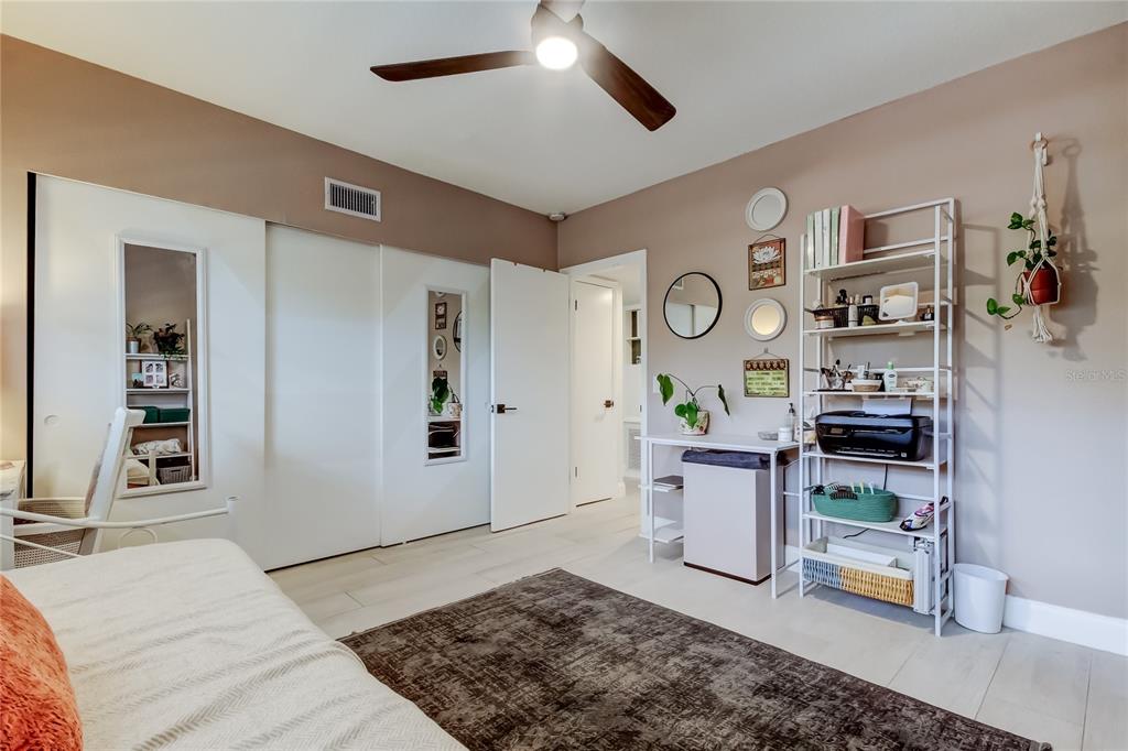 2170 Americus Boulevard North, Unit 64 Clearwater, FL 33763 - Photo 27 of 66 a living room with stainless steel appliances kitchen island granite countertop furniture and a rug