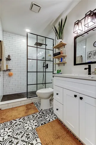 a bedroom with furniture and a flat screen tv