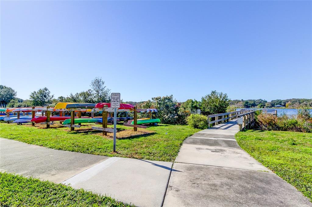 2170 Americus Boulevard North, Unit 64 Clearwater, FL 33763 - Photo 37 of 66 a childrens park with lots of swings and slides