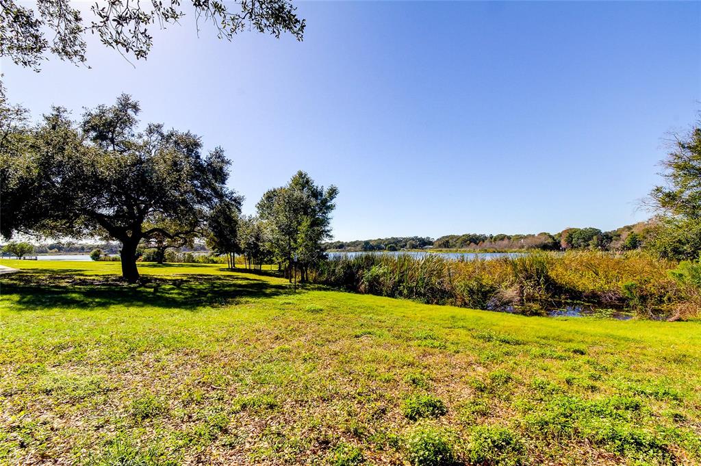 2170 Americus Boulevard North, Unit 64 Clearwater, FL 33763 - Photo 40 of 66 a view of swimming pool with an outdoor space and seating area