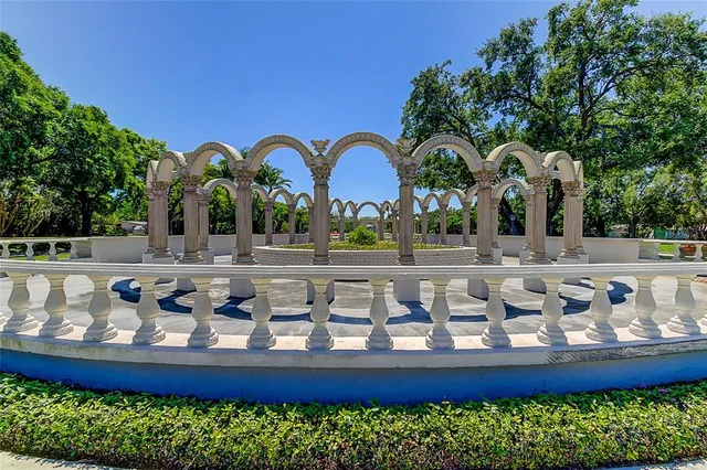 a view of a swimming pool with outdoor seating