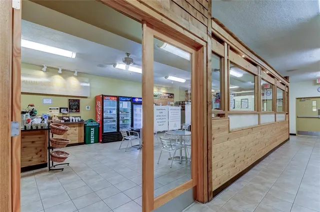 a view of swimming pool with outdoor seating and plants